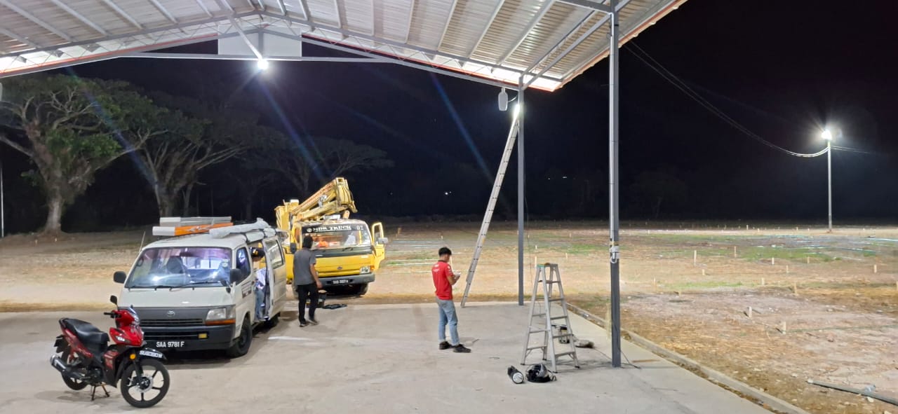 May be an image of 2 people, lighting and text