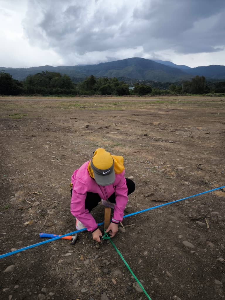 May be an image of 1 person and grass